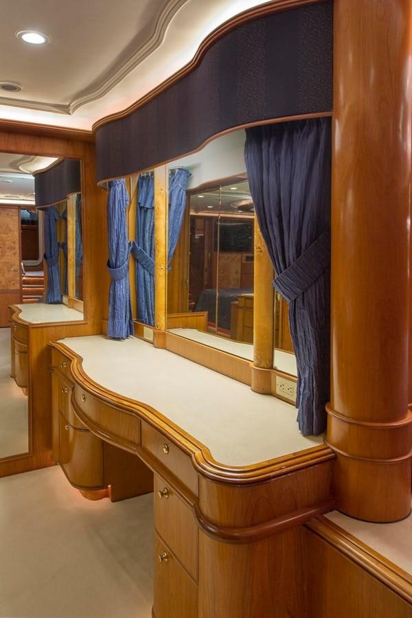 a room with a blue curtain aboard SILVER WINGS Yacht for Sale