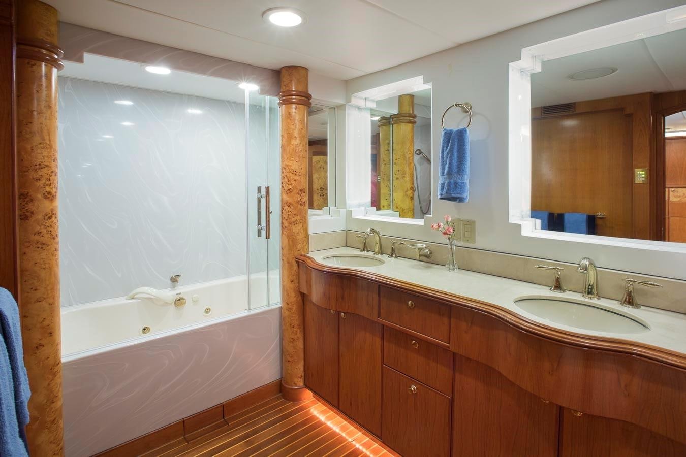 a bathroom with a large mirror aboard SILVER WINGS Yacht for Sale
