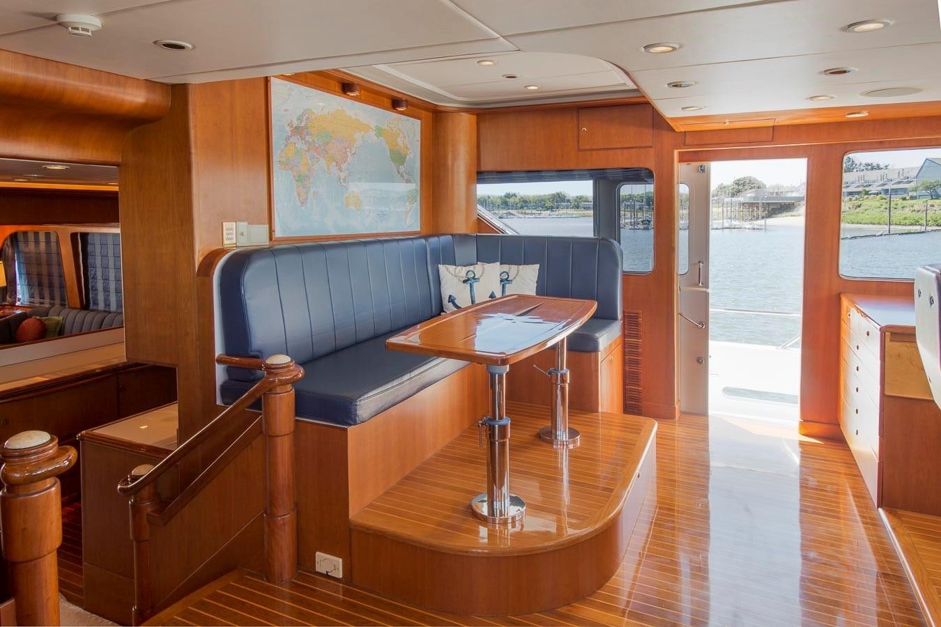 a living room with a couch and a table aboard SILVER WINGS Yacht for Sale