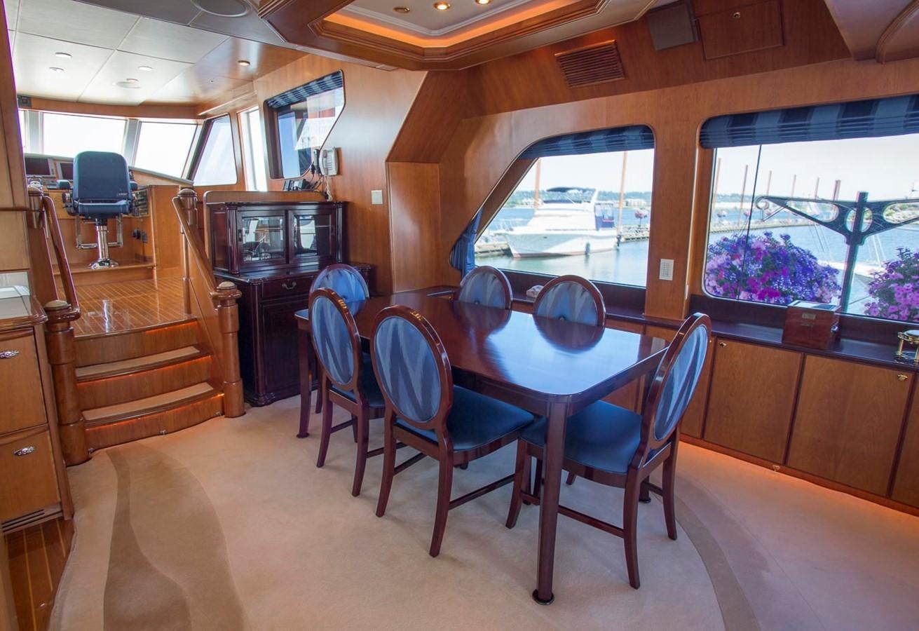 a dining room with a table and chairs aboard SILVER WINGS Yacht for Sale