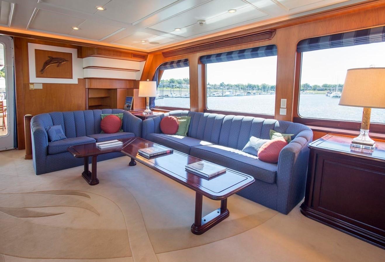 a living room with a couch and a coffee table aboard SILVER WINGS Yacht for Sale