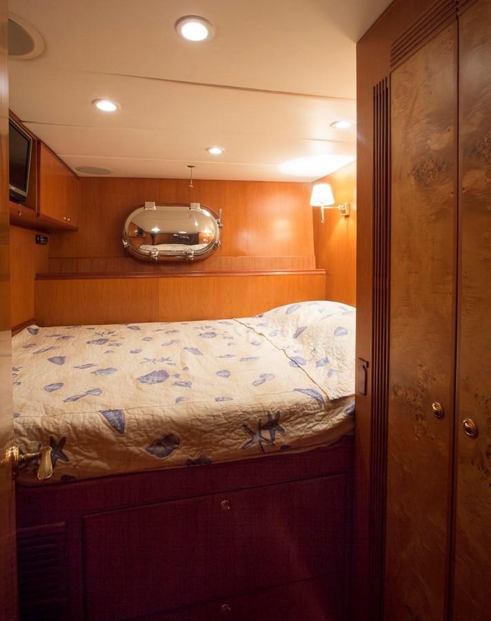 a bed with a mirror above it aboard SILVER WINGS Yacht for Sale