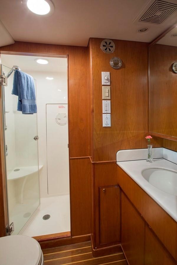 a bathroom with a sink and a shower aboard SILVER WINGS Yacht for Sale