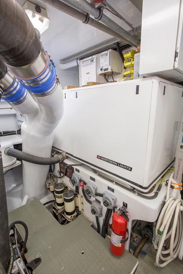 a person working on a machine aboard SILVER WINGS Yacht for Sale