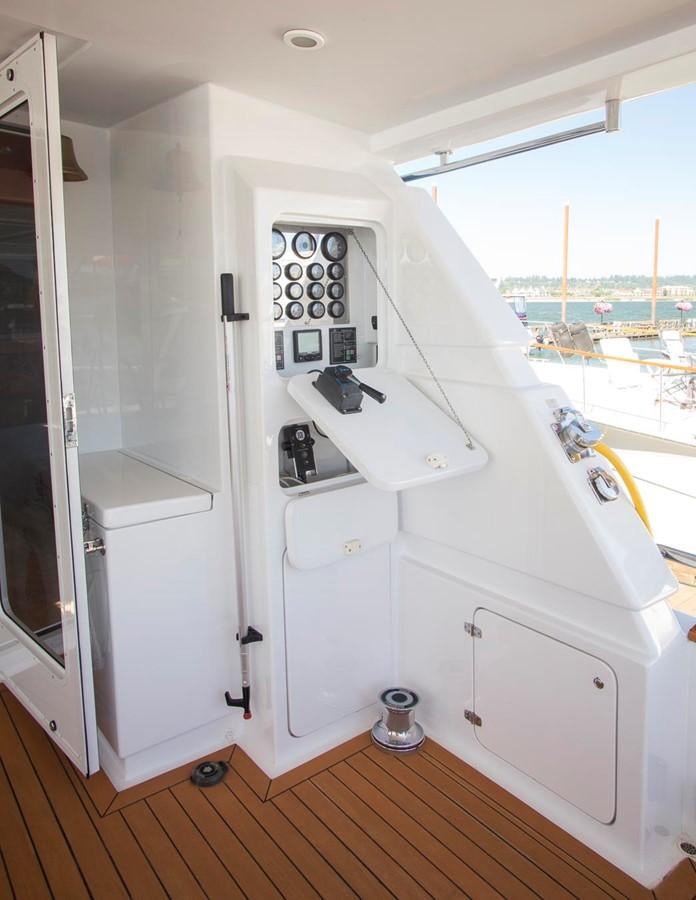a white kitchen with a large window aboard SILVER WINGS Yacht for Sale