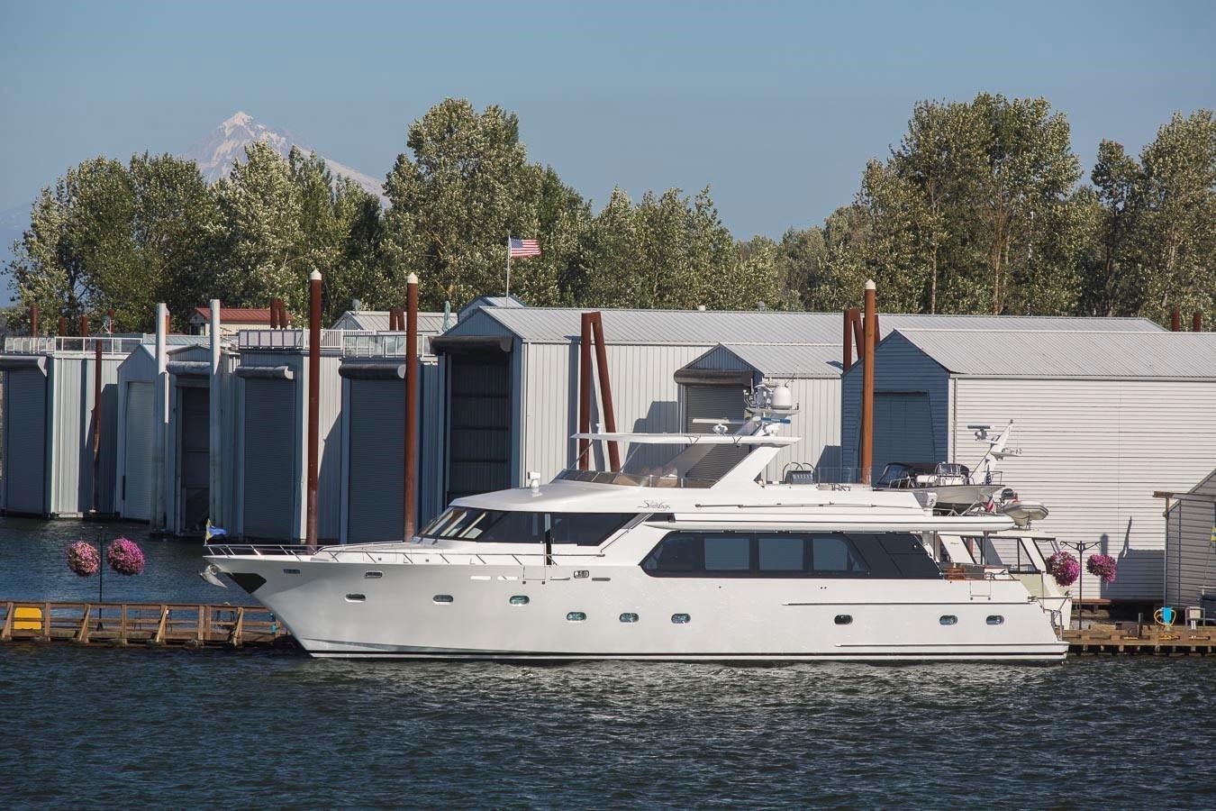 a boat docked in a harbor aboard SILVER WINGS Yacht for Sale