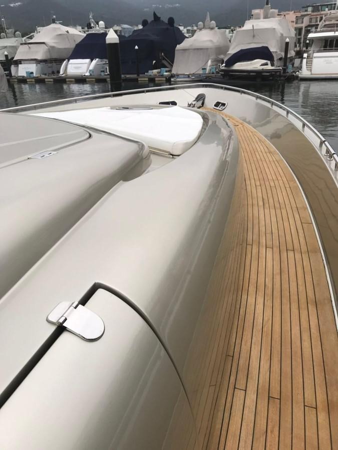 a deck with a deck and a boat in the water aboard PERSHING 90/12 Yacht for Sale