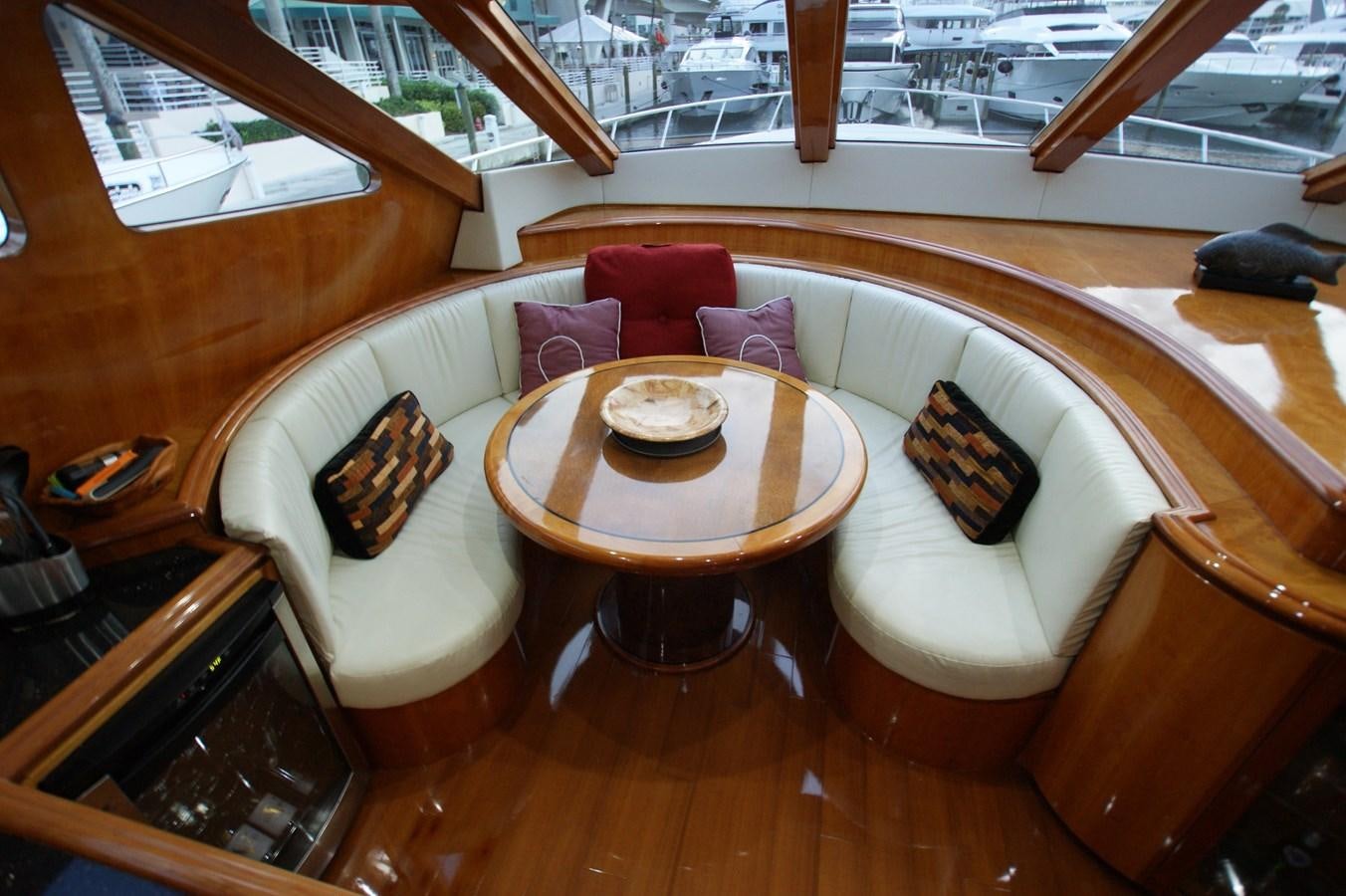 a room with a table and chairs aboard LORI ANN Yacht for Sale