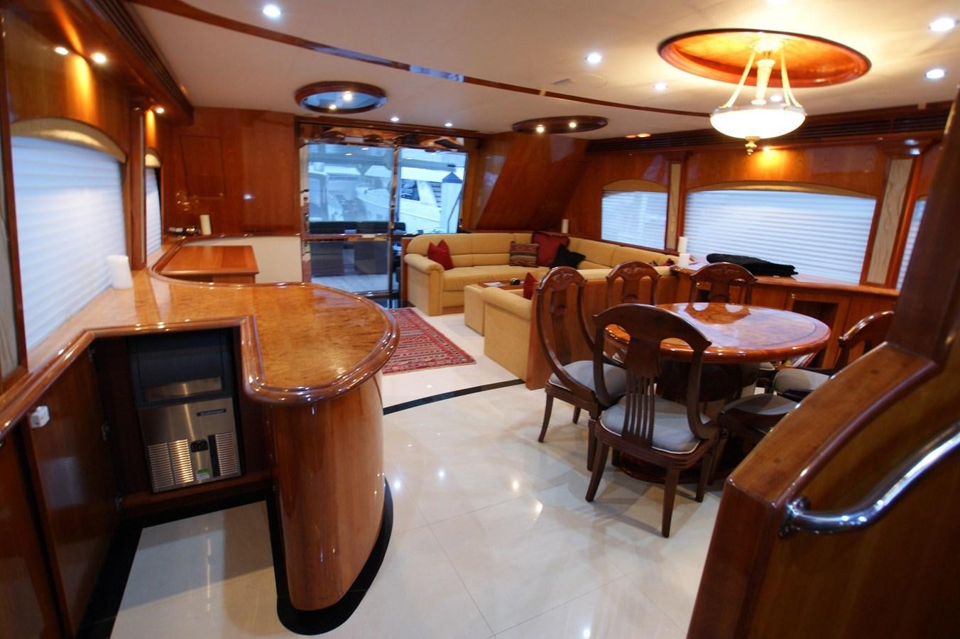 a large dining room with a bar aboard LORI ANN Yacht for Sale