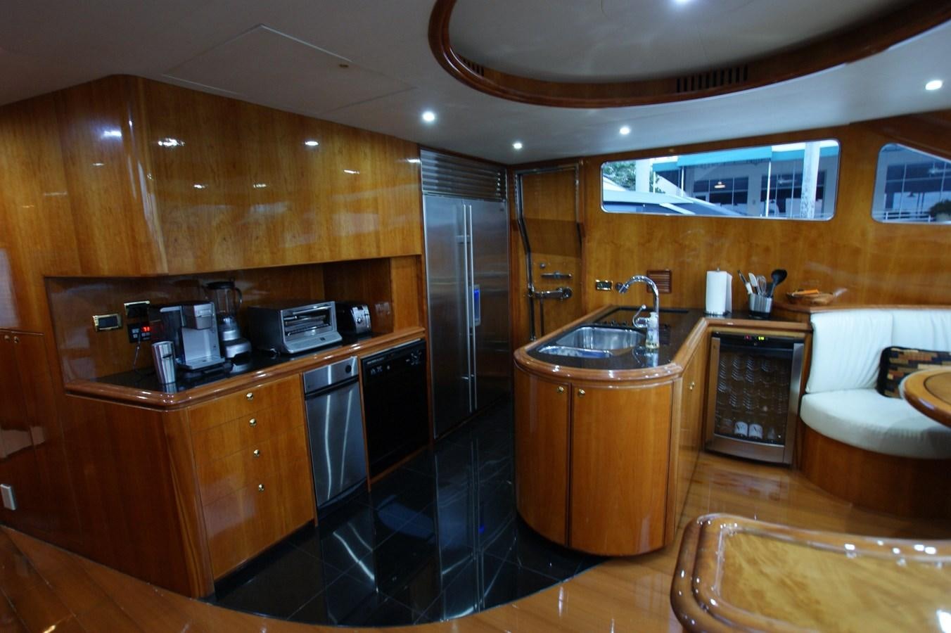 a kitchen with a black counter aboard LORI ANN Yacht for Sale