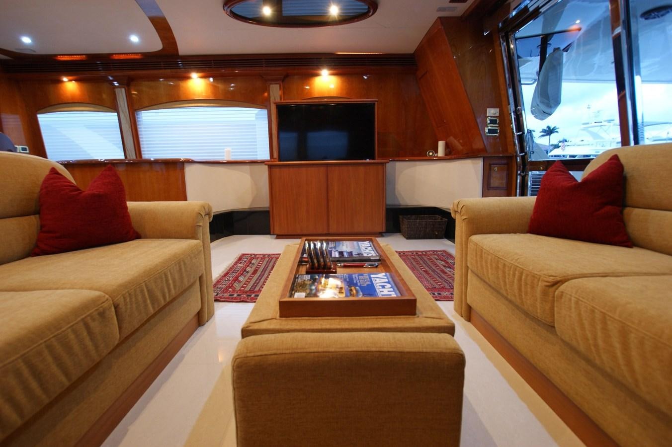 a living room with couches aboard LORI ANN Yacht for Sale
