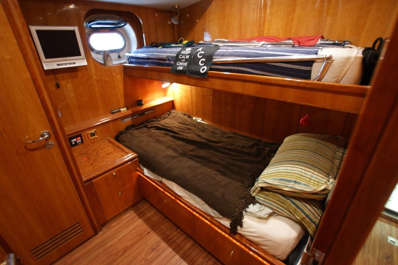 a bed with a television on top of it aboard LORI ANN Yacht for Sale