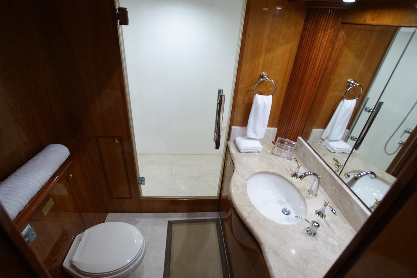 a bathroom with a sink and a toilet aboard LORI ANN Yacht for Sale