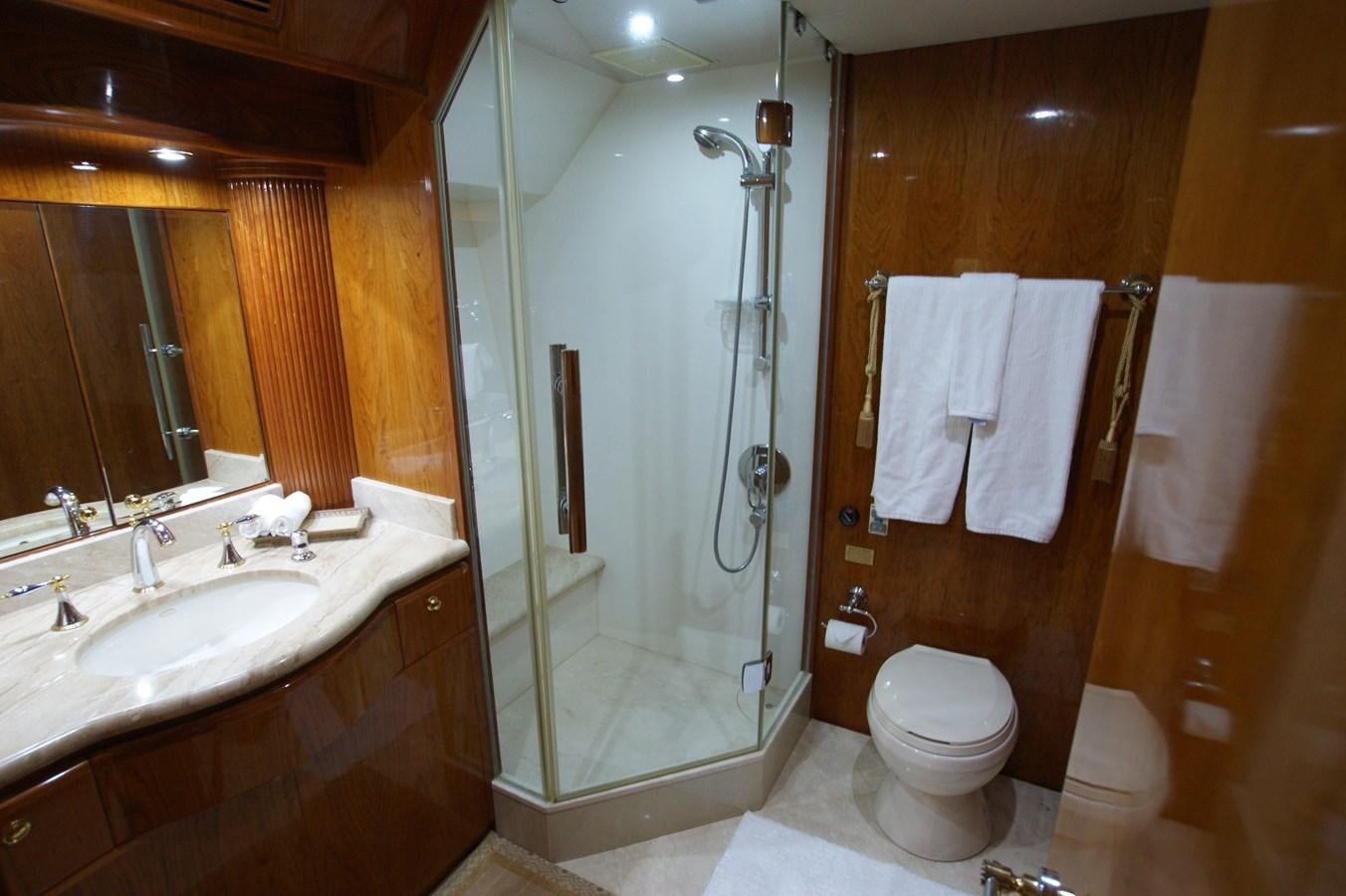 a bathroom with a shower and sink aboard LORI ANN Yacht for Sale