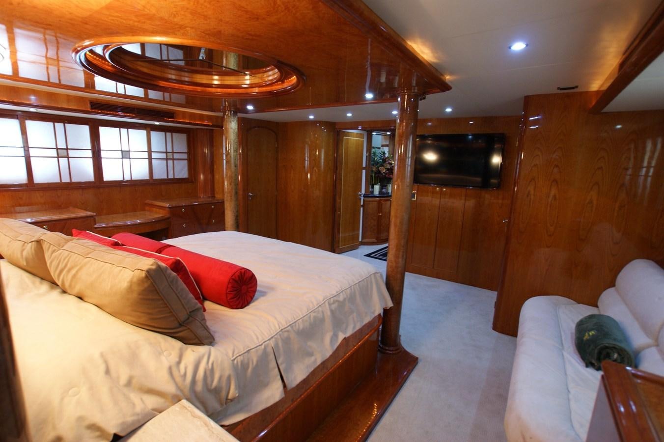 a room with a bed and a wood wall aboard LORI ANN Yacht for Sale