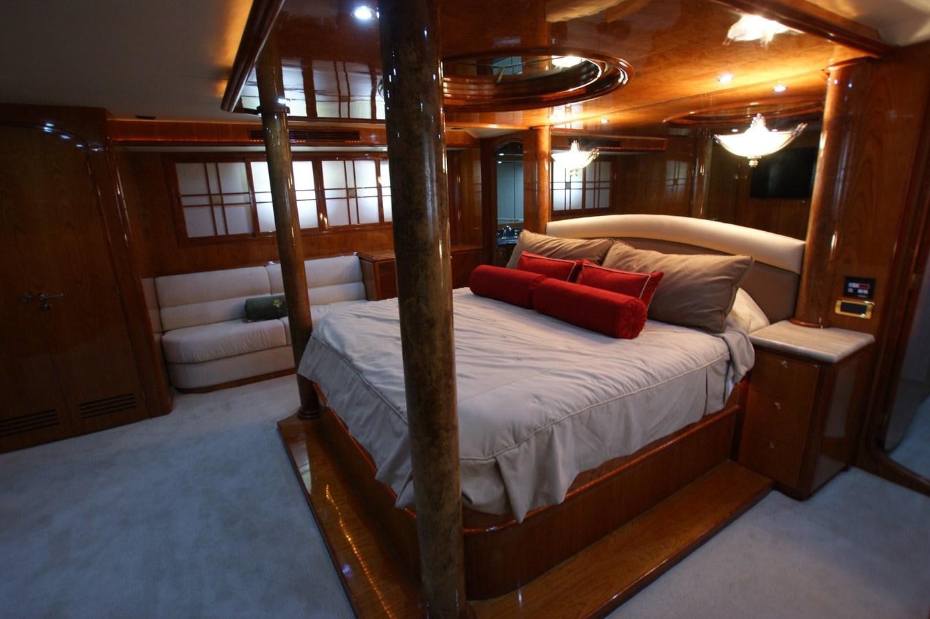 a room with a bed and a chair aboard LORI ANN Yacht for Sale