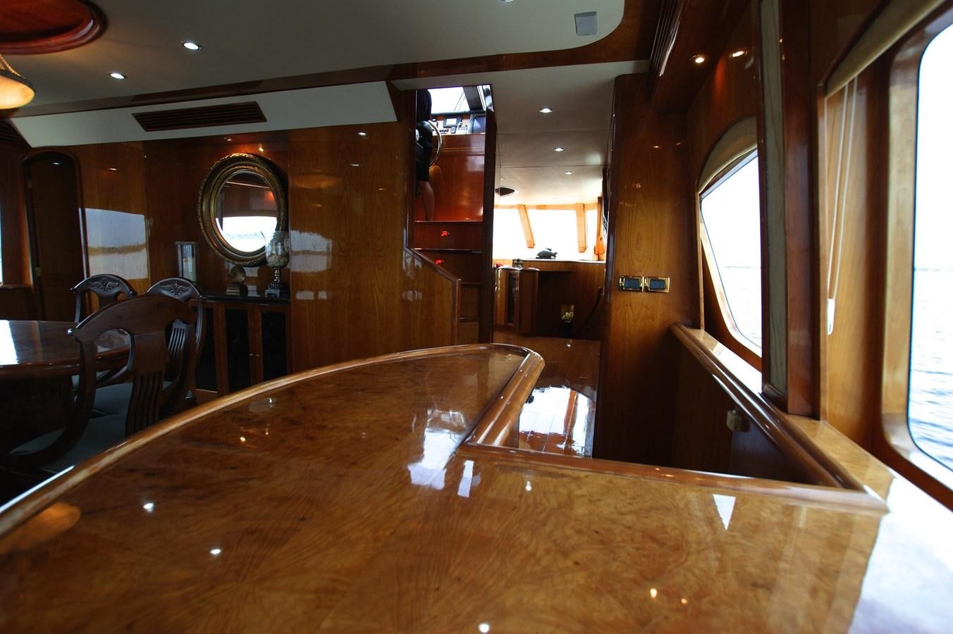 a bar with a table and chairs aboard LORI ANN Yacht for Sale