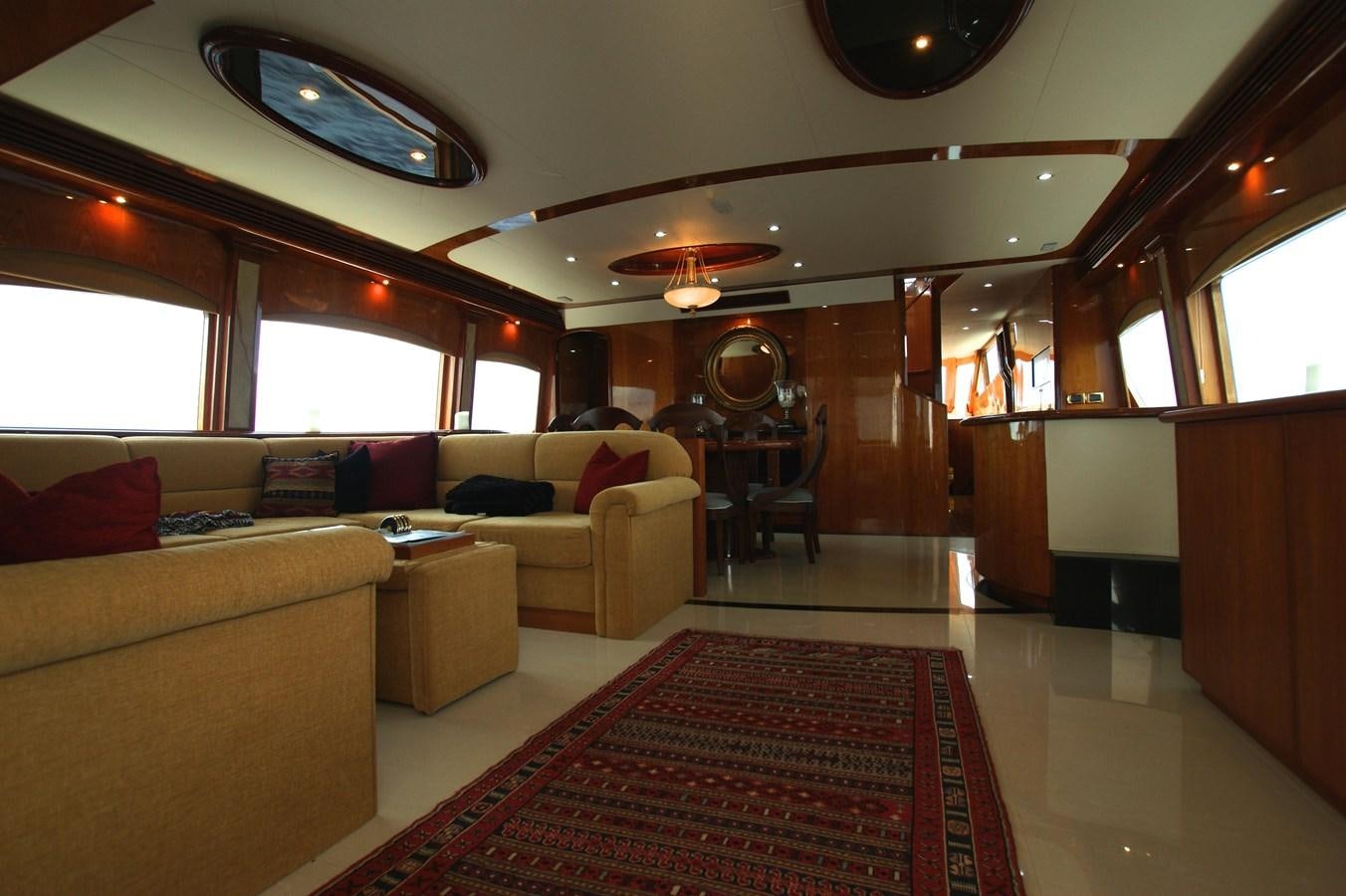 a living room with a red rug aboard LORI ANN Yacht for Sale