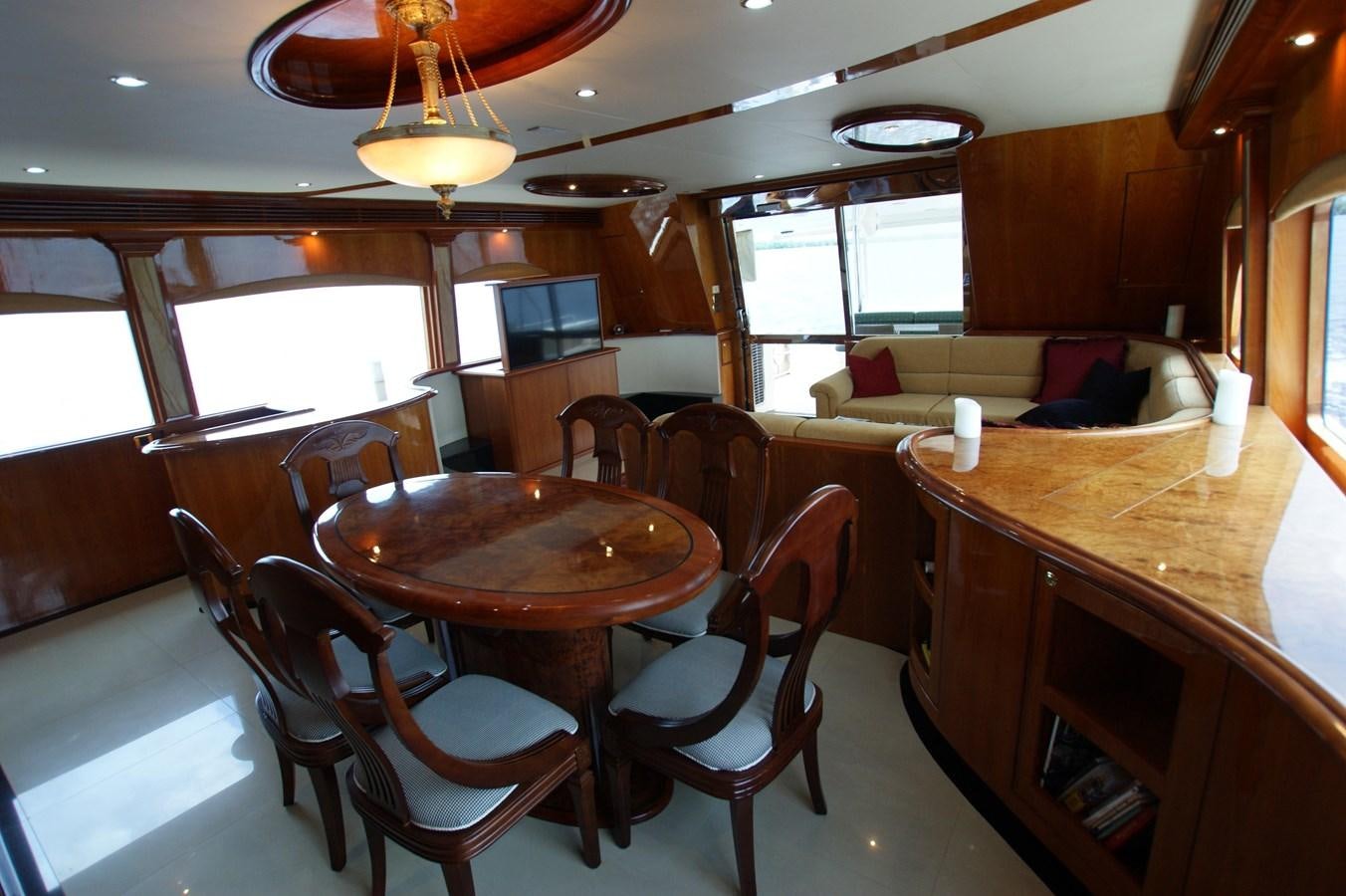 a dining room with a table and chairs aboard LORI ANN Yacht for Sale