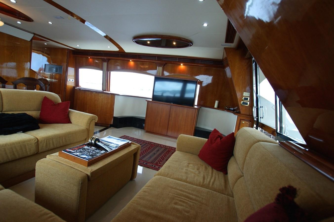 a living room with a couch and a television aboard LORI ANN Yacht for Sale