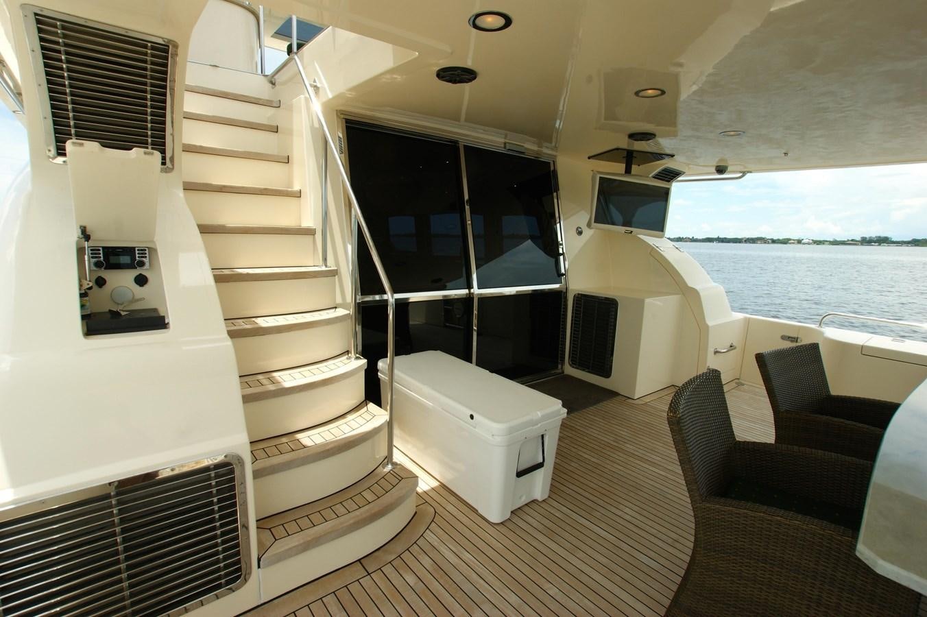 a room with a staircase and a large window aboard LORI ANN Yacht for Sale