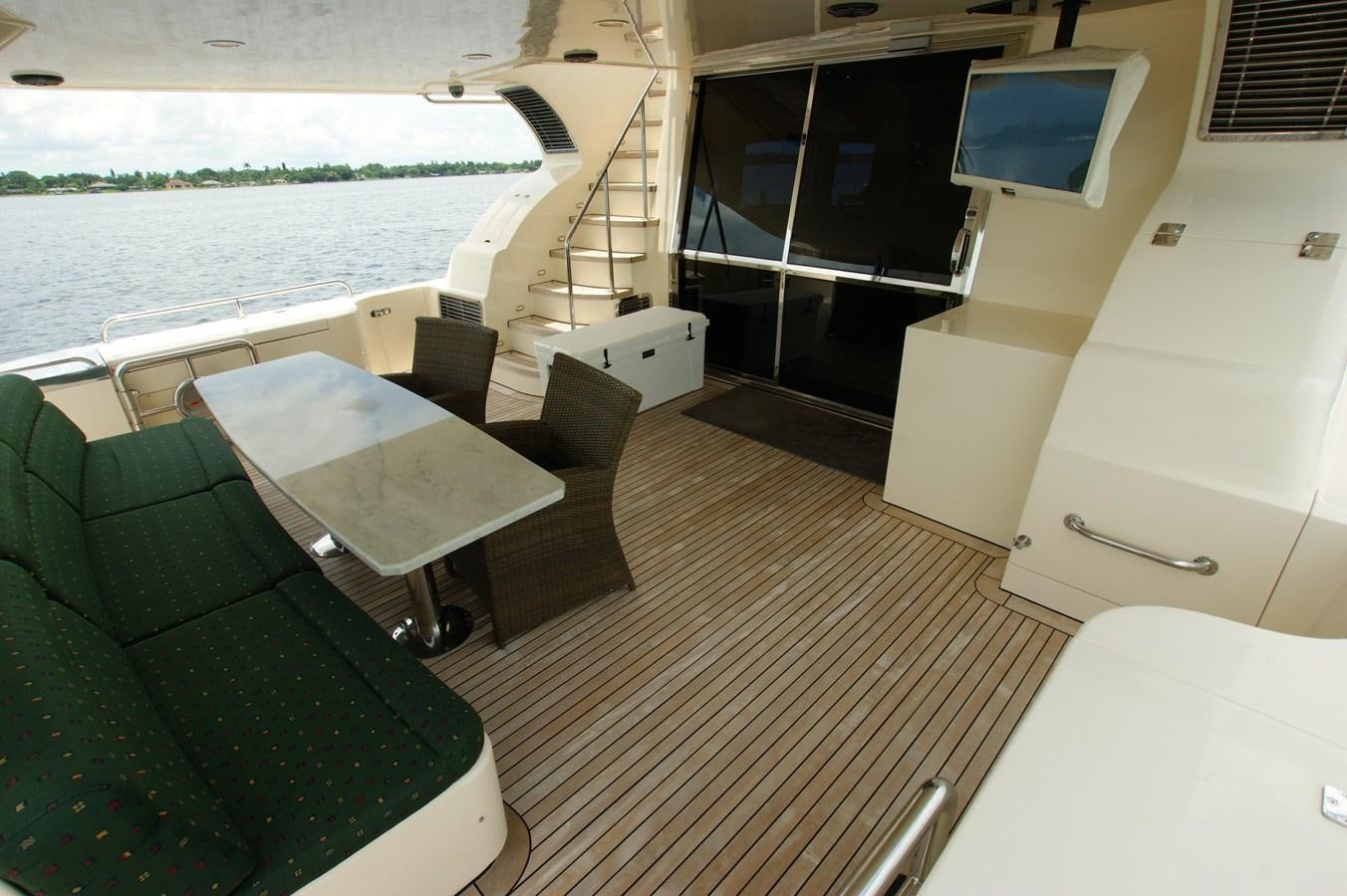 a room with a couch and a table and a television aboard LORI ANN Yacht for Sale