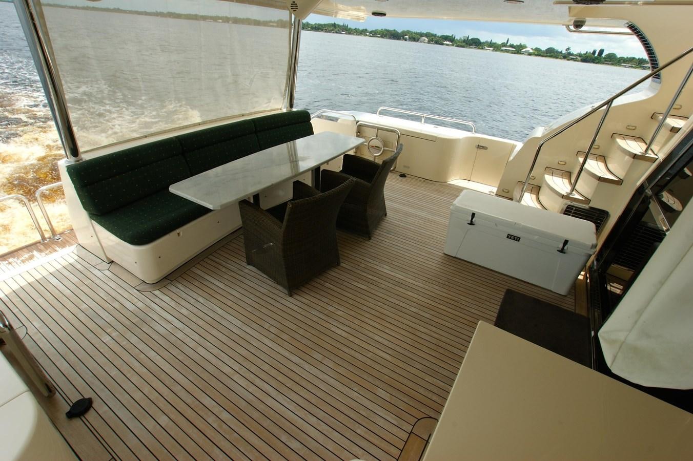a room with a couch and a table and chairs aboard LORI ANN Yacht for Sale
