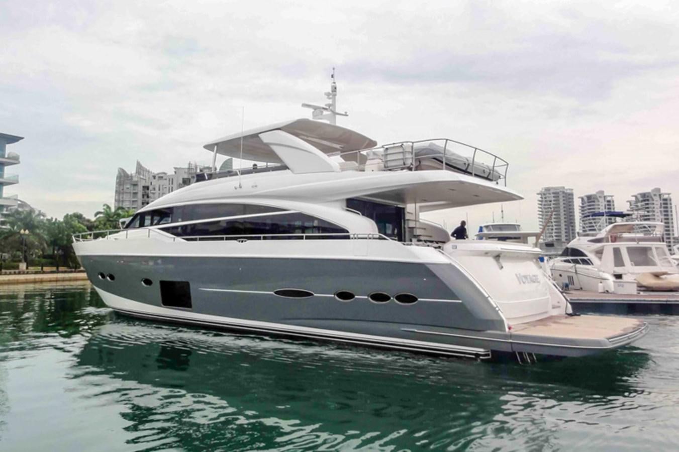a white yacht in a harbor aboard SEDNA Yacht for Sale