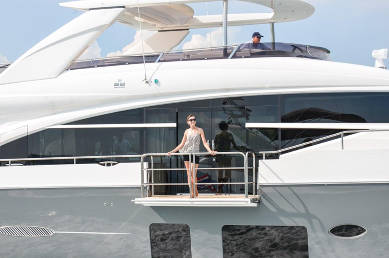 a group of people standing on a boat aboard SEDNA Yacht for Sale