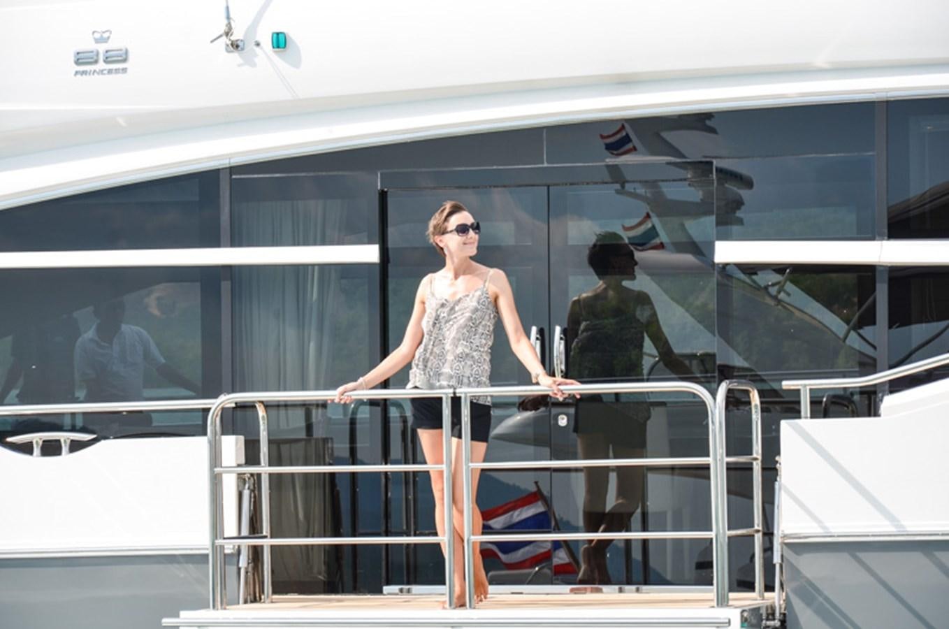 a person standing on a balcony aboard SEDNA Yacht for Sale