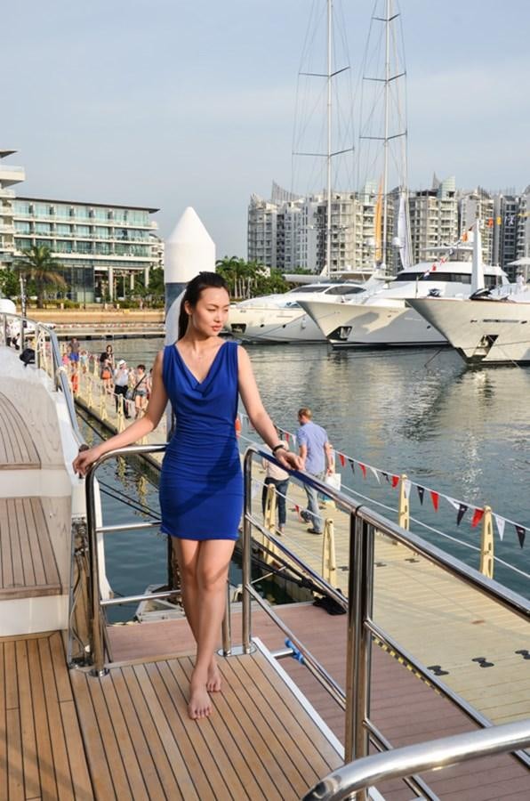 a woman standing on a dock aboard SEDNA Yacht for Sale