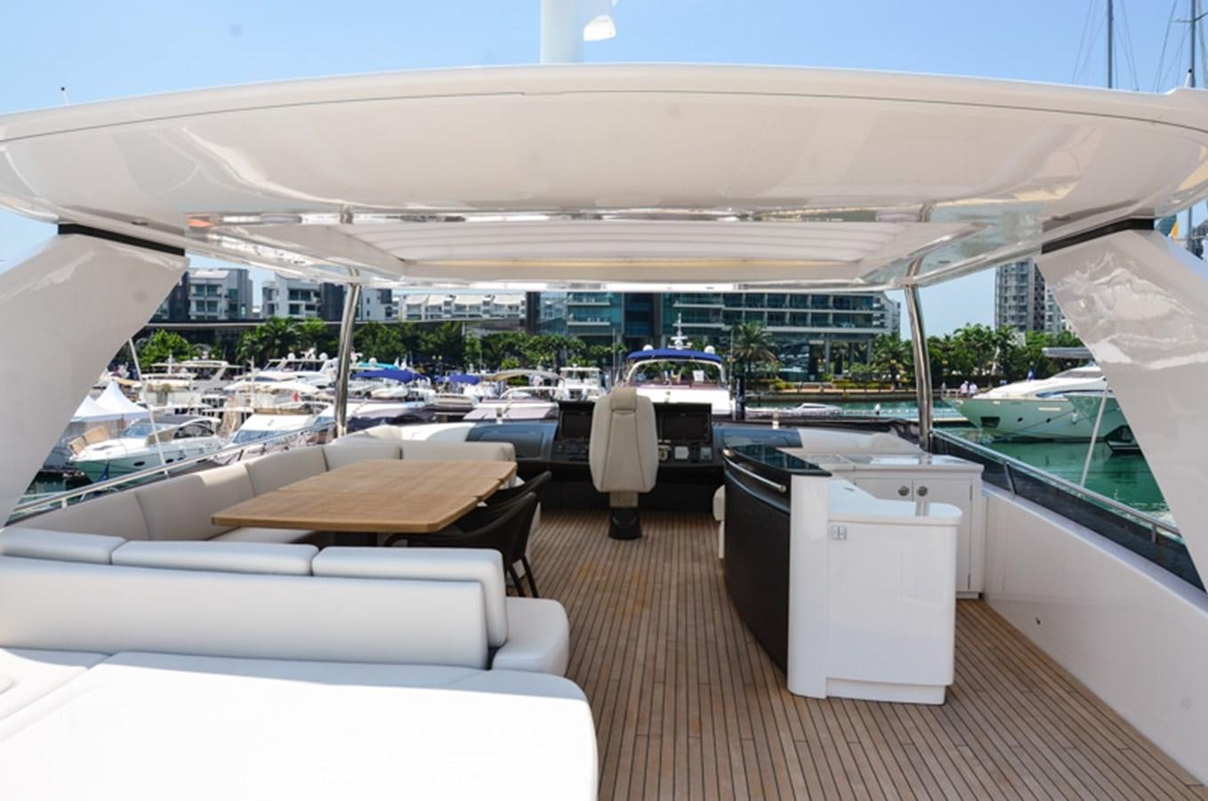 a large room with a table and chairs and a large building with a view of the water and aboard SEDNA Yacht for Sale