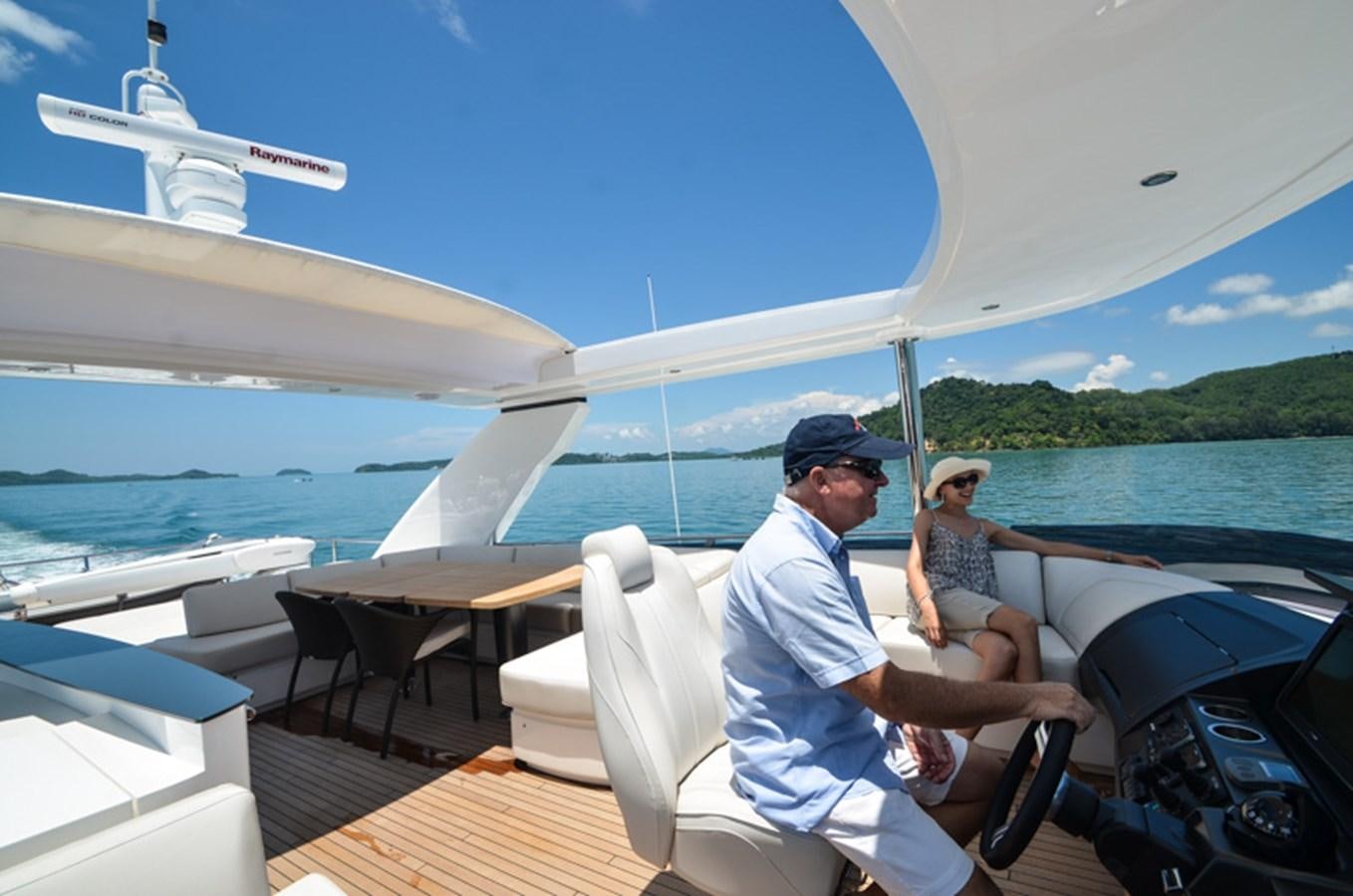 a man and woman on a boat aboard SEDNA Yacht for Sale