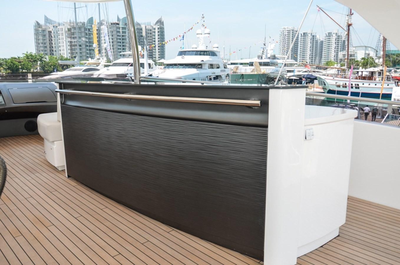 a deck with a large ship in the background aboard SEDNA Yacht for Sale
