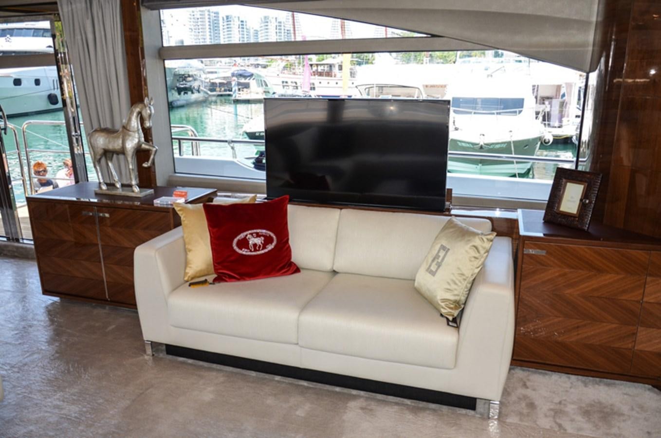 a couch in a living room aboard SEDNA Yacht for Sale