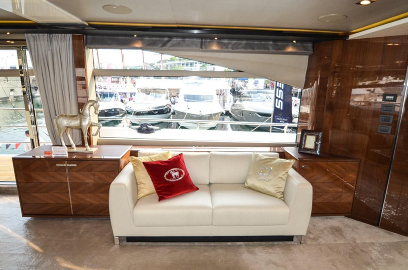 a white couch in a room aboard SEDNA Yacht for Sale