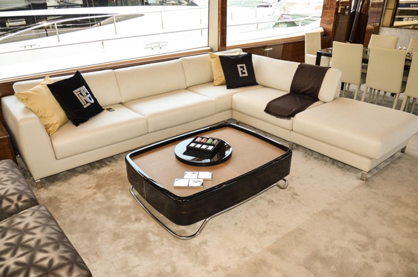 a couch with a coffee table aboard SEDNA Yacht for Sale
