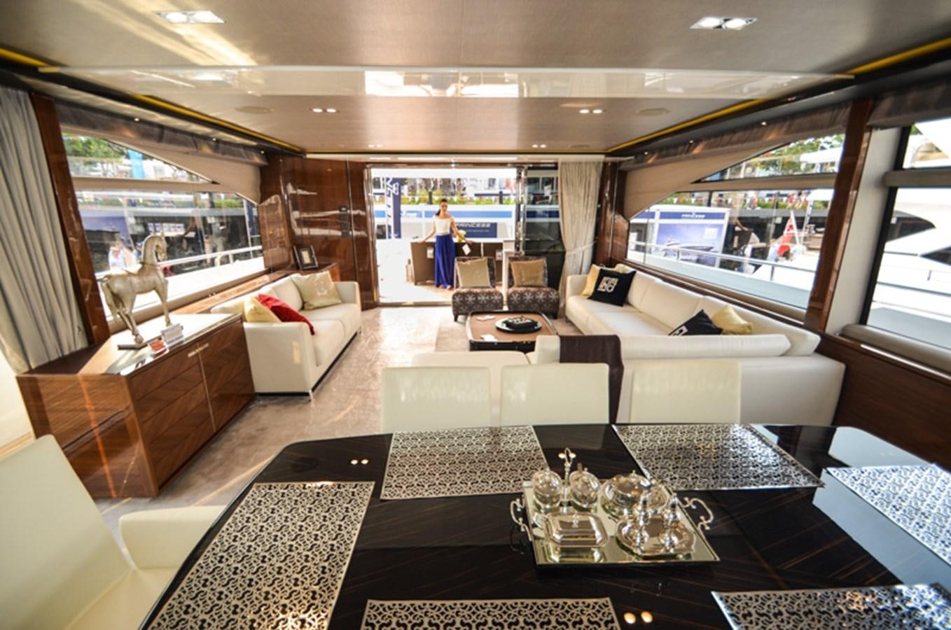 a room with couches and a table aboard SEDNA Yacht for Sale