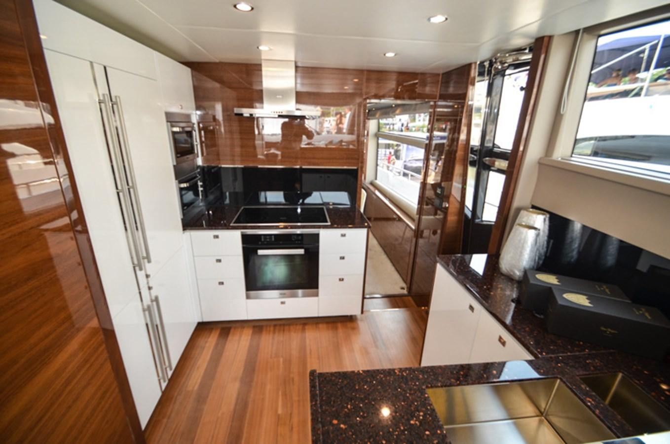 a kitchen with a wood floor aboard SEDNA Yacht for Sale