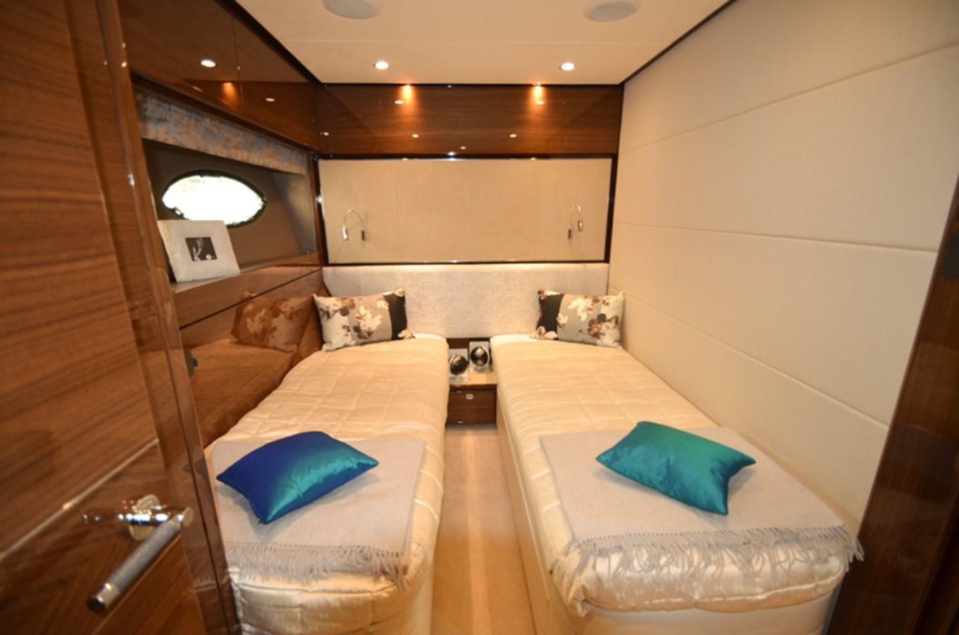 a living room with a couch and a mirror aboard SEDNA Yacht for Sale