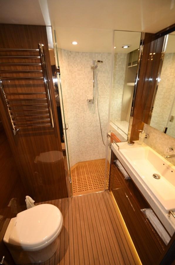 a bathroom with a toilet and sink aboard SEDNA Yacht for Sale