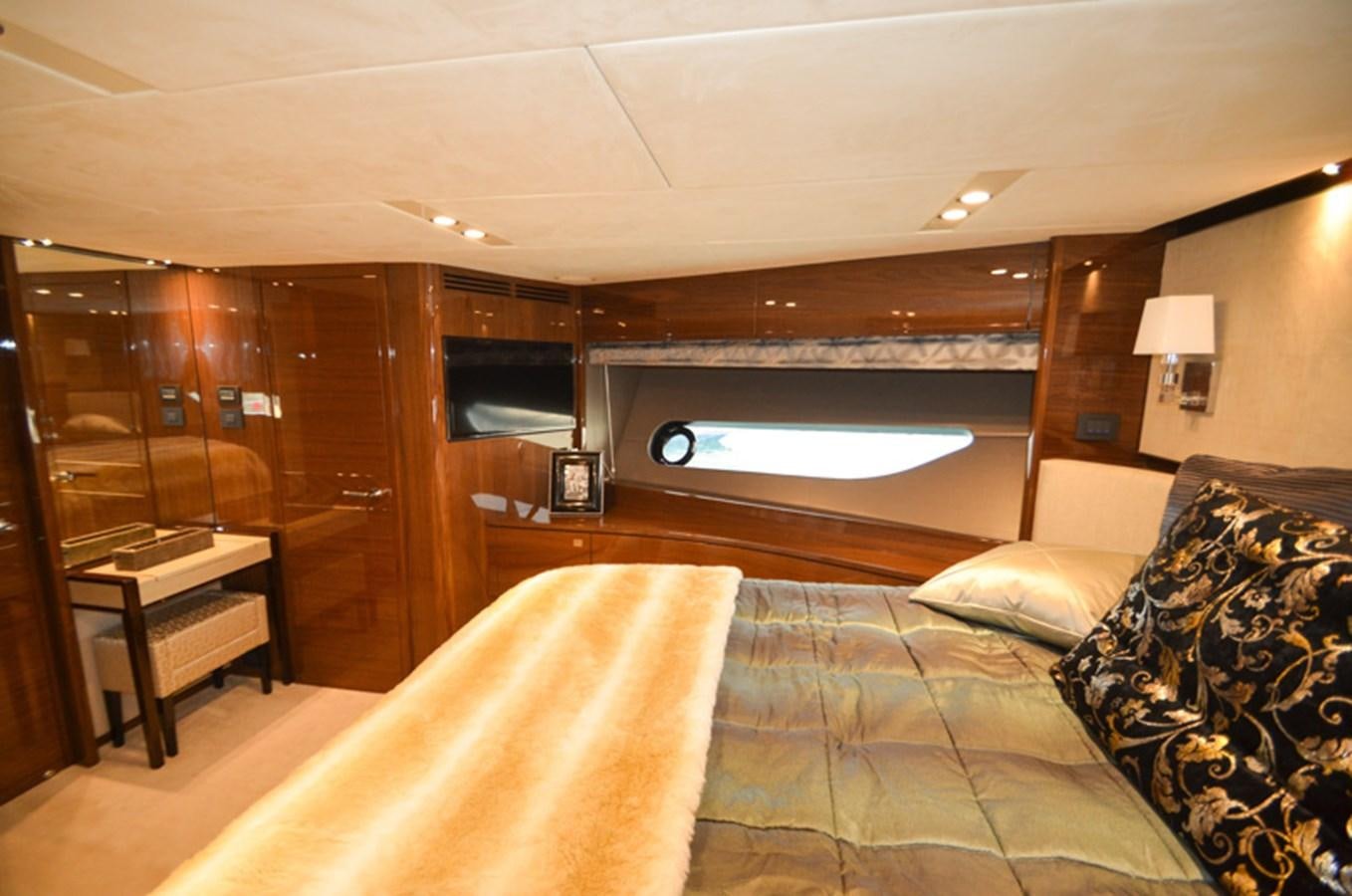 a hotel room with a bed and a tv aboard SEDNA Yacht for Sale