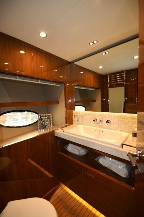 a bathroom with a large mirror aboard SEDNA Yacht for Sale