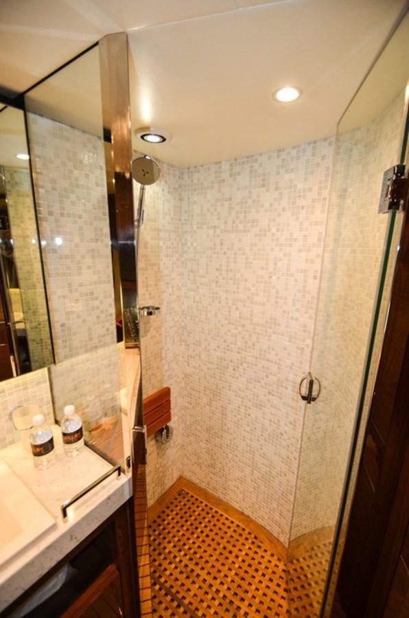 a bathroom with a shower unit and a mirror aboard SEDNA Yacht for Sale