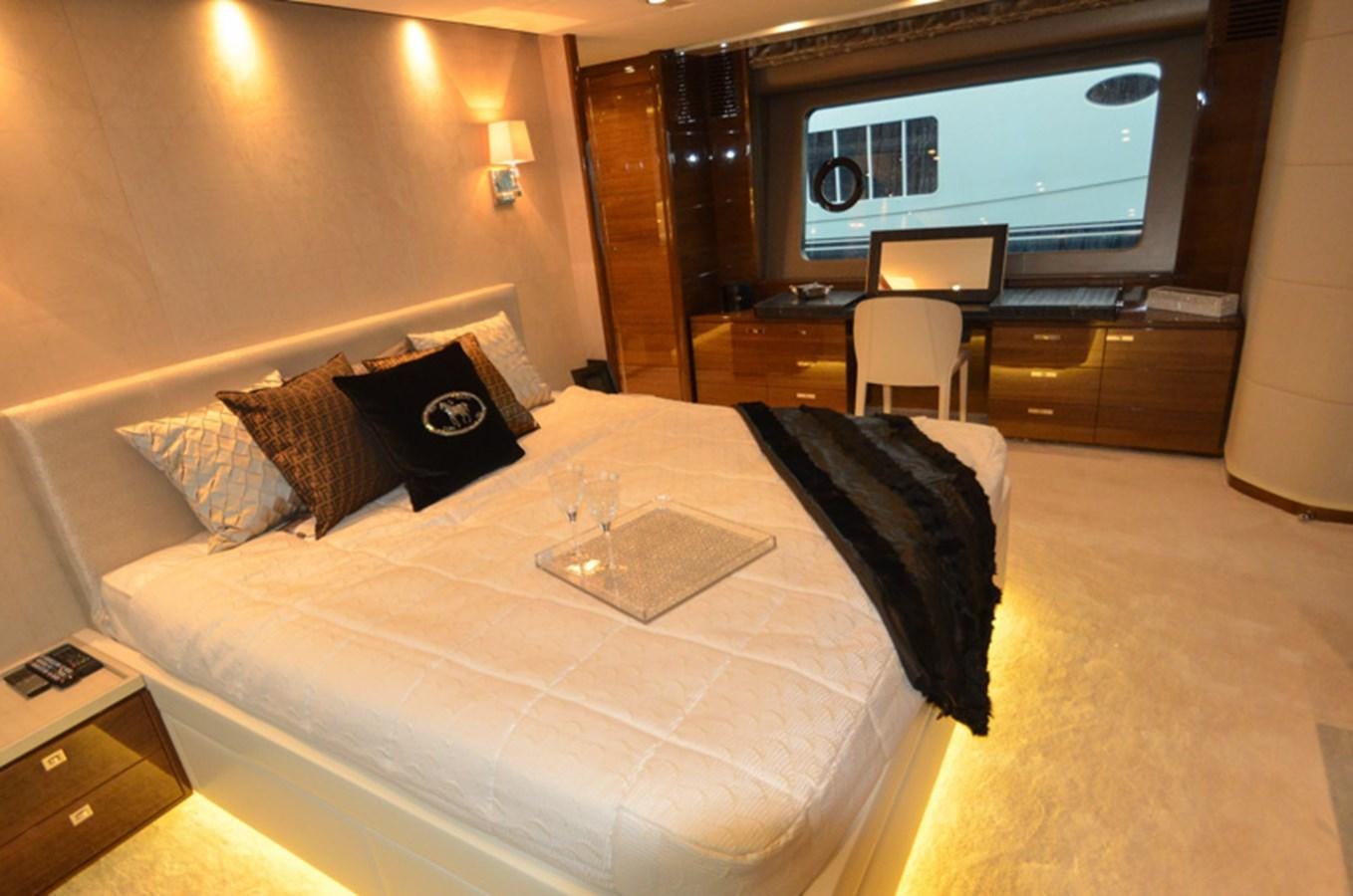 a hotel room with a bed and tv aboard SEDNA Yacht for Sale