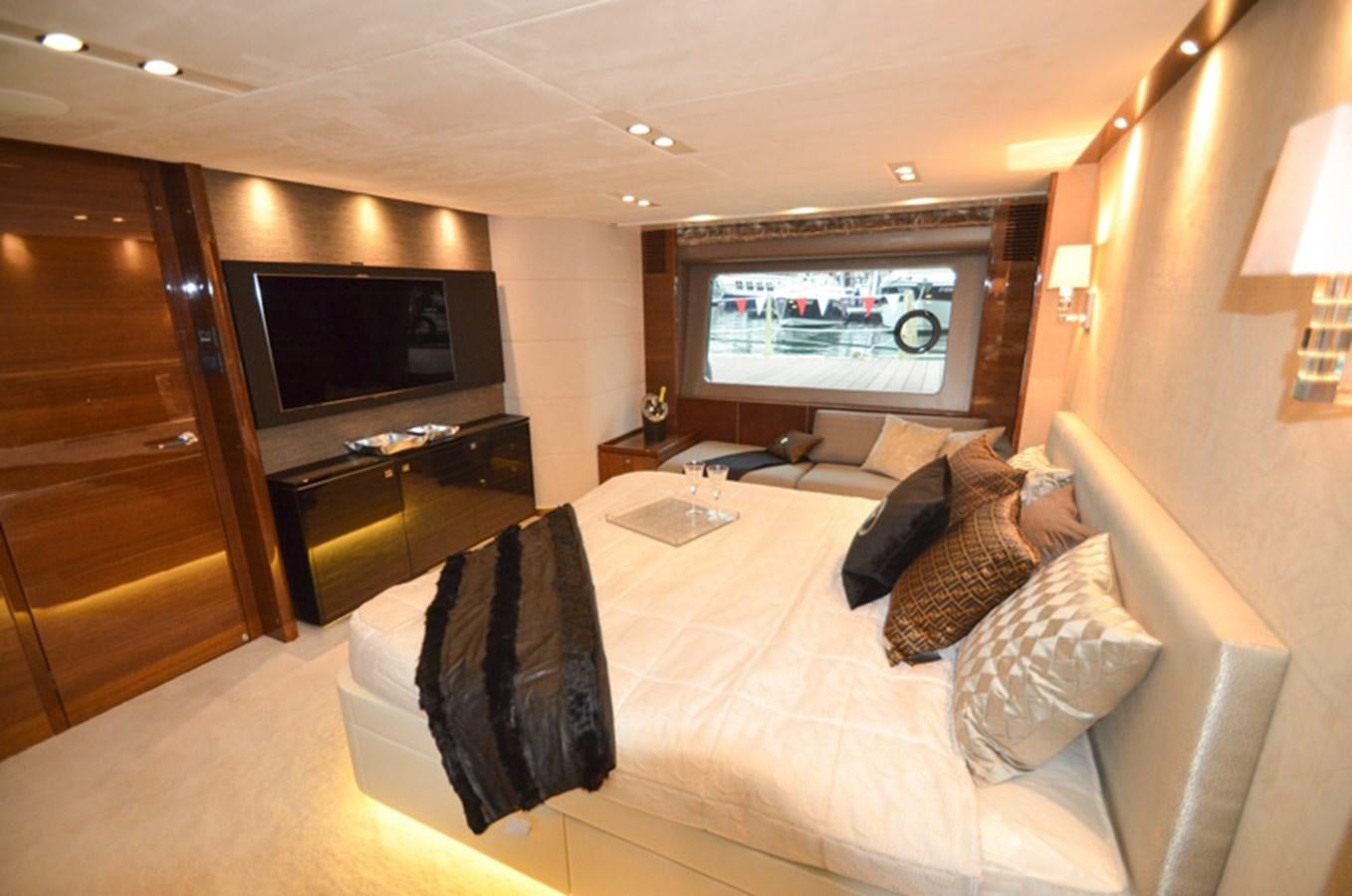 a hotel room with a bed and tv aboard SEDNA Yacht for Sale