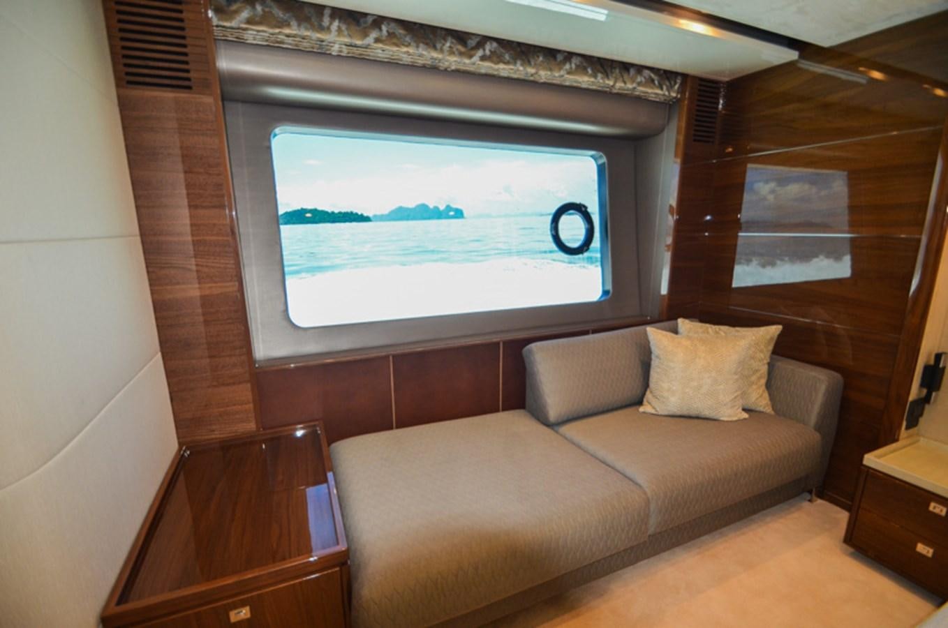 a room with a couch and a tv aboard SEDNA Yacht for Sale