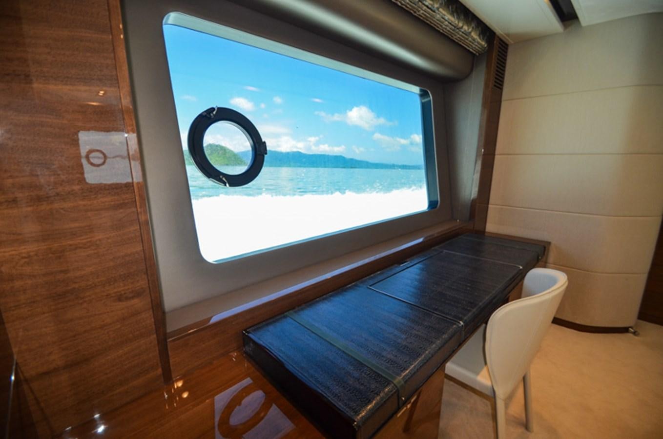 a tv on a table aboard SEDNA Yacht for Sale