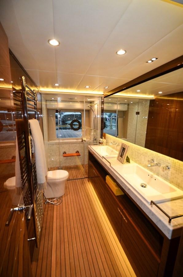 a bathroom with a large mirror aboard SEDNA Yacht for Sale