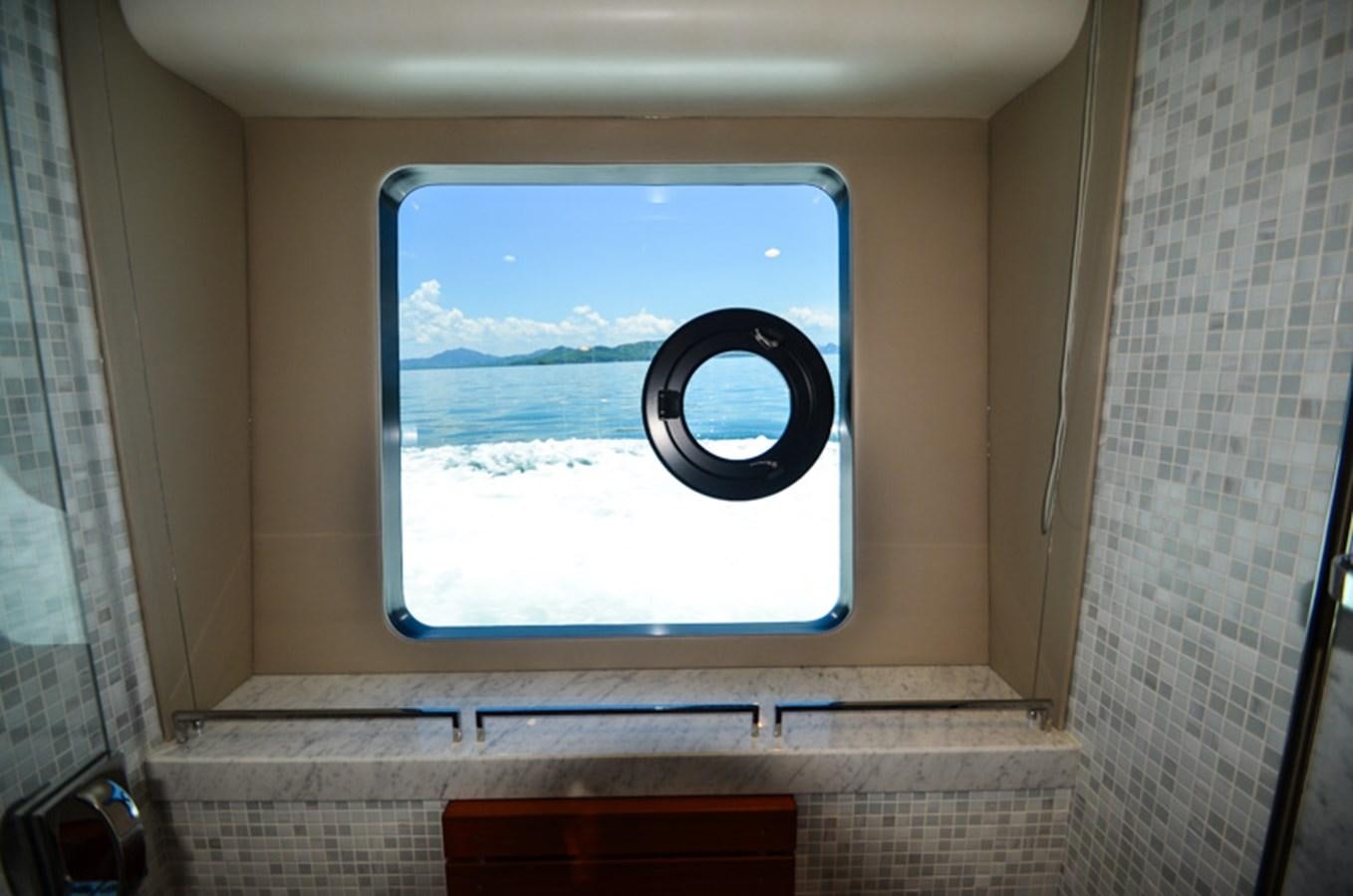 a window with a view of the ocean aboard SEDNA Yacht for Sale